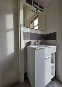 a bathroom with a sink and a mirror at Il Melangolo in SantʼAntìoco +21 photos