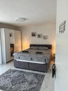 a bedroom with a large bed in a room at Apartman Stari Grad in Cazin
