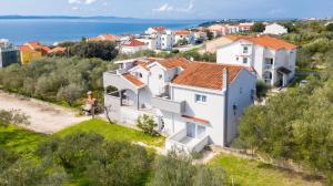 an image of a house with the ocean in the background at Villa Mirena in Kožino
