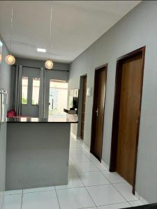 a kitchen with a counter top in a room at Dunas residence casa 04 in Santo Amaro +73 photos