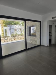 a room with a large glass window in a house at Moraira B5 in Moraira