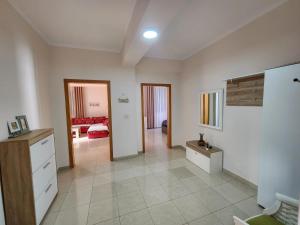 a room with a kitchen and a living room at Jozi Kaiser Apartment 2 in Durrës