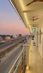 a balcony with a view of a highway at Gravity Groups AARA Residency - Near Jipmer in Puducherry Airpoert