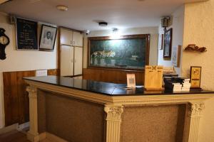 a table in a room with a counter top at Hotel J'S Heritage in Kodaikānāl