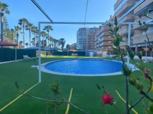 a swimming pool in the middle of a building at Magic World Vistamar lll in El Borseral