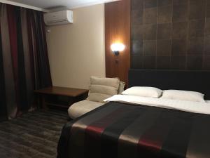Postel nebo postele na pokoji v ubytování Alexandra Apartments