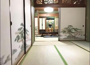 an entrance to a room with a door with a view at RYU in Hatsukaichi