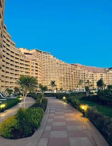 a large building with a pathway in front of it at Porto Sokhna Pyramids - For Families Only vip in Ain Sokhna