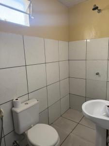 a bathroom with a toilet and a sink at Guest House da Amazônia in Manaus +10 photos
