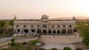 an image of a building with a courtyard at Jaisamand Garh Resort in Udaipur