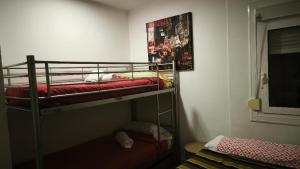 a bedroom with two bunk beds in a room at Hollywood Palazzo in Roses