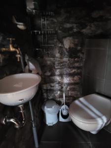 a bathroom with a sink and a toilet at Alte Schmiede in Halver