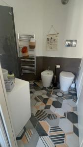 a bathroom with a toilet and a bidet at Maison Grimoaldo10 in Salerno +93 photos