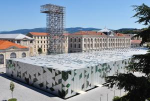 a large building with a glass roof in a city at L'Escale Gare Châteaucreux avec Garage in Saint-Étienne