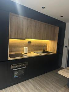 a kitchen with a sink and a counter top at L'Escale Gare Châteaucreux avec Garage in Saint-Étienne