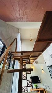 a stairway in a room with a ceiling at The Western Inn in Mananthavady