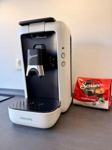 a toaster sitting on a counter next to a bag of snacks at Smart Business Studio in Itzehoe