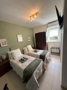 a hotel room with two beds and a window at Silent Lake View in Valentano