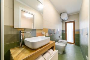 a bathroom with a sink and a toilet at Estate4home - Suites Margar in Massa Lubrense +62 photos
