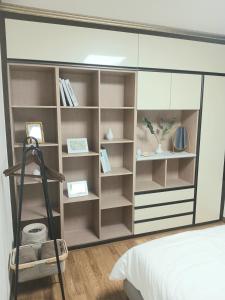 a bedroom with a large book shelf at 부산남포 프론트오션뷰 in Busan