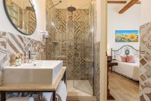 a bathroom with a white sink and a shower at Villa Fontis Rapolano in Rapolano Terme +33 photos