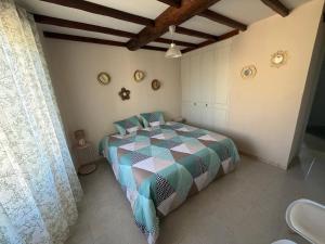 a bedroom with a bed in a room at Le PATIO Beau Duplex terrasse 2 chambres 5mn théâtre antique in Orange
