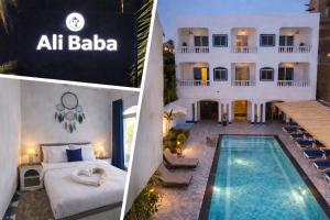 a hotel with a swimming pool and a villa at Ali Baba Hotel in Luxor