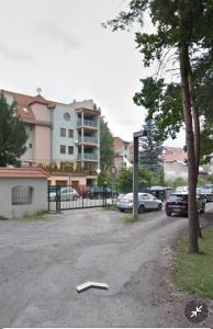 a road with a book on the ground next to a building at Penzion Moyzes in Banská Bystrica