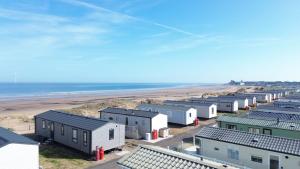 an aerial view of a row of houses and the beach at Celebration by the sea in Redcar