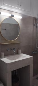 a bathroom with a sink and a mirror at NMD house in Ermioni +45 photos