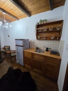 a kitchen with a sink and a counter top at Olympia Cozy House in Palaios Panteleimonas
