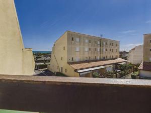 a view from the balcony of a building at Studio cabine mezzanine 6 pers avec parking privé - FR-1-326-403 in Marseillan