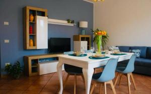 a living room with a white table and chairs at AR House in Clusane sul Lago