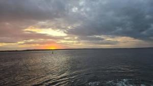 a sunset over a large body of water at Villas House - Praia Formosa - Cabedelo in Cabedelo