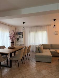a living room with a table and a couch at Šumska kuća Juga Kovačević in Bela Crkva +40 photos