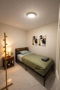 a bedroom with a bed and a lamp in it at Riio Shores in Miami +10 photos