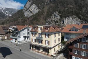 an aerial view of a town with houses and a mountain at Apartment Troya in Unterseen