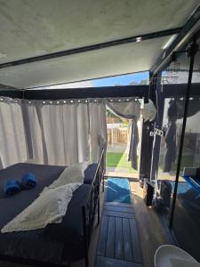 a bedroom with a bed in a tent at Spa Ibiza Dosrius - Bungalow con Jacuzzi y Piscina privada in Canyamás +73 photos