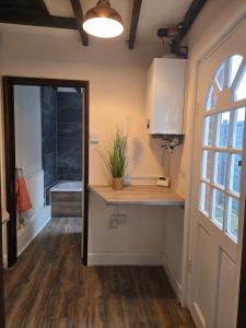 a bathroom with a counter and a sink in a room at The Indigo Escape in Ibstock +16 photos