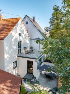 an aerial view of a white house with a patio at Haus MALEA by Wohn-Zeit - über 200 Betten im Umkreis von 87700 Memmingen in Fellheim +9 photos