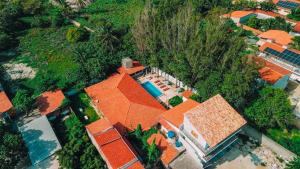 an overhead view of a house with an orange roof at Pousada EcoVillage - Meu Xodó em Preá in Prea