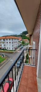 a balcony with a view of a street at Apartamento Mar in Bádames