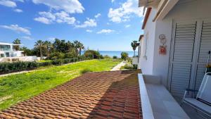 a house with a view of the ocean at Sundy Beach Seaview 2BDR Larnaka Dhekelia in Larnaca