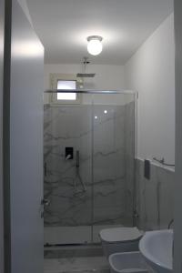 a bathroom with a shower and a toilet and a sink at Villa Iside Casavacanze in Gragnano