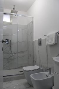 a bathroom with a shower and a toilet and a sink at Villa Iside Casavacanze in Gragnano +19 photos