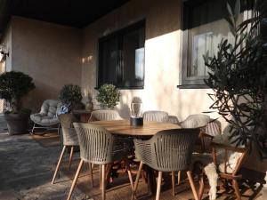 a wooden table and chairs in a patio at Casa Diego in Spielberg