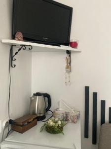a shelf with a tv on top of a wall at Refugiul Castelului in Hunedoara +15 photos