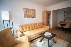 a living room with a couch and a table at ApartCieszyn - Apartament Liburnia in Cieszyn