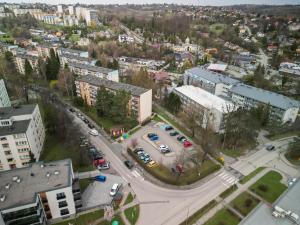 an aerial view of a city with cars parked in a parking lot at ApartCieszyn - Apartament Liburnia in Cieszyn