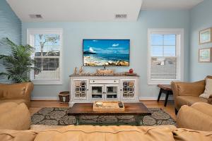 a living room with a couch and a table at 14111 Fiesta Rd - Cape Canoe in Ocean City
